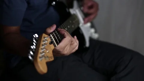 Close-up view of hands playing electric guitar Stock Footage 79589014