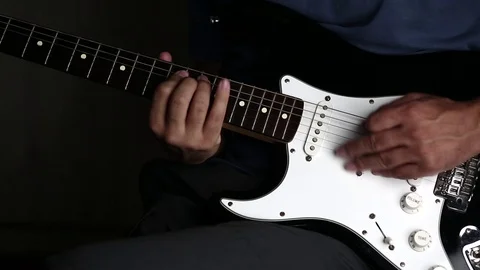 Close-up view of hands playing electric guitar Stock Footage 79589059
