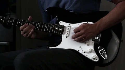 Close-up view of hands playing electric guitar Stock Footage 79589259