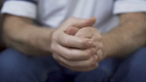 Close up view of the hands of senior old nervous man in trouble. Man rubbing his Video stock 105233825