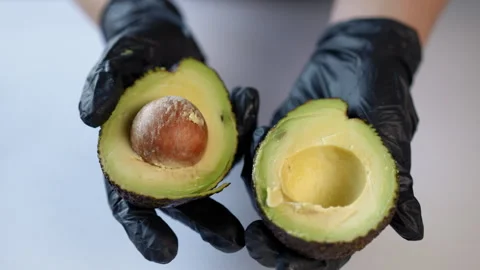 A Close Up View of Hands Skillfully Manipulating a Mysterious Object While  Stock Footage 296631720