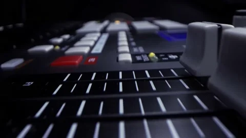 Close up view hands using faders and control knobs on synthesizer or sound mixer Stock Footage 150230389