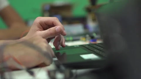 Close-Up View of Hands Using a Laptop Touchpad During Daily Computer Work Stock Footage 347957884