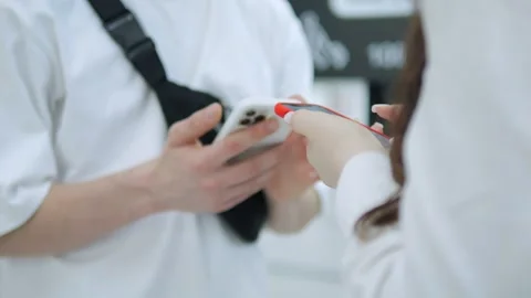 Close-up view of hands using phone on moving escalator Stock Footage 311620852