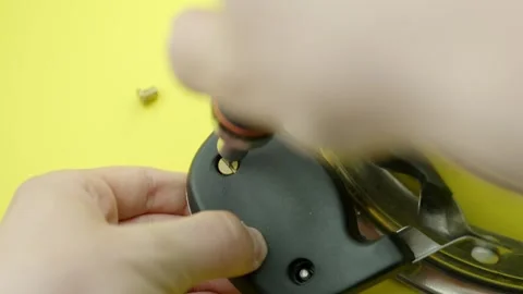Close-up view of hands using screwdriver to repair and assemble boiler Stock Footage 310588539