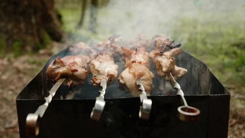 Close up view of hands in white gloves rolling half-cooked chicken meat on Stock-Footage 114374208
