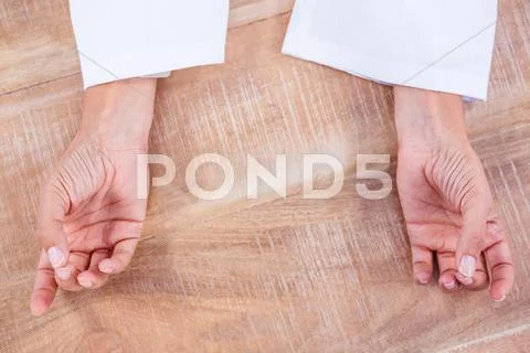 Close Up View Of Hands In Yoga Pose