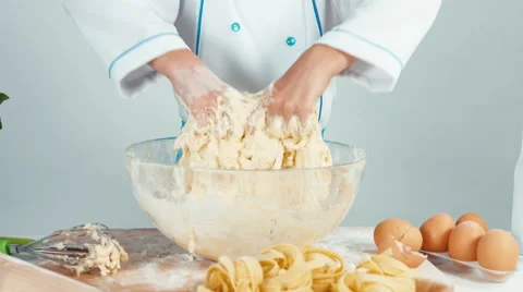 Close up view of hands young baker girl making dough Video stock 68084389
