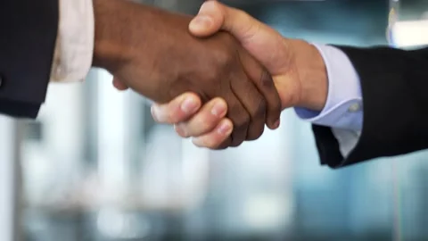 Close-up view of handshake between two businessmen in formal suits Stock Footage 336556234