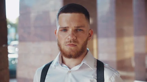 Close up view of handsome attractive blue eyed bearded man with freckles on his Stock Footage 115667009