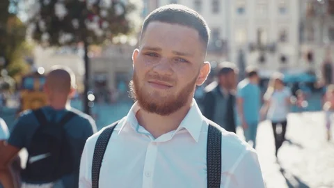 Close up view of handsome attractive young Caucasian blue-eyed bearded man Stock Footage 115666842