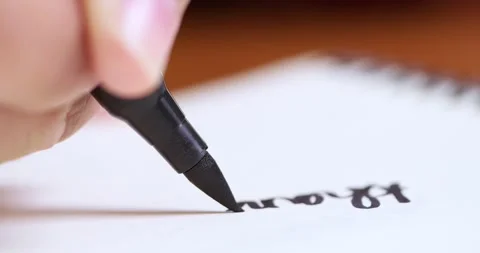 A close-up view of handwriting practice showcasing focus and skill development Stock Footage 313611067