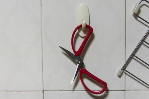 Close up view of hanging the red scissors 写真素材