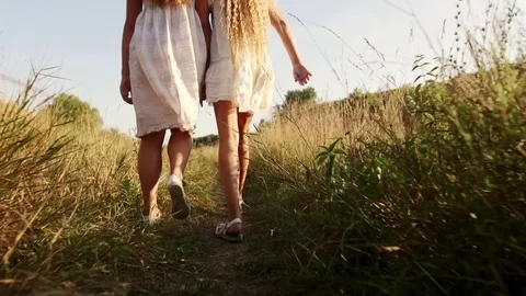Close up view of happy children in a white dresses dancing, whirling and Stock Footage 79854550