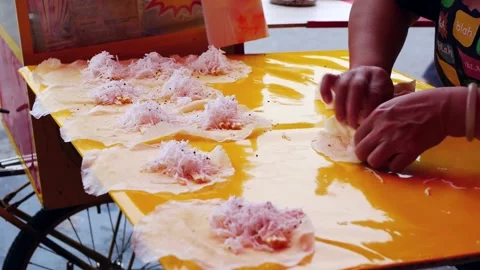 Close up view of a hawker wrapping the Vietnamese popiah. 動画素材 214345452
