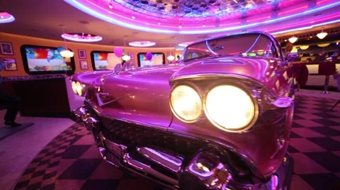 Close up view of headlights on car in Beverly Hills Diner Stock Footage 62156394