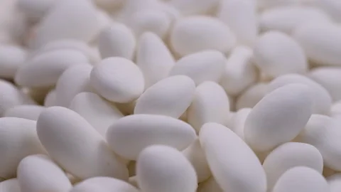 Close up view. Heap of white chocolate covered almond nuts. Slider shot. Stock Footage 296558548