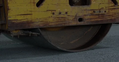 Close up view of a heavy compactor pressing the concrete, construction, 4k Stock Footage 156889166