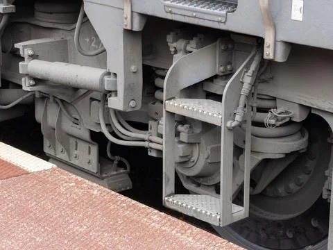 A close view of a heavy train wheel assembly and metal ladder, highlighting 스톡 사진