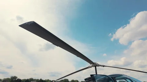 Close view of the Helicopter propeller in the beautiful blue sky at su Stock-Footage 304407445