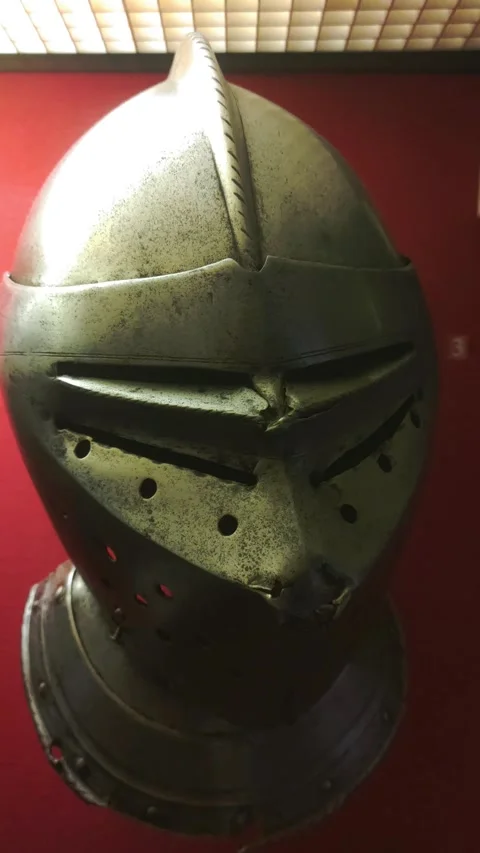 A close-up view of a helmet sitting on a bright red background Stock Footage 322534845