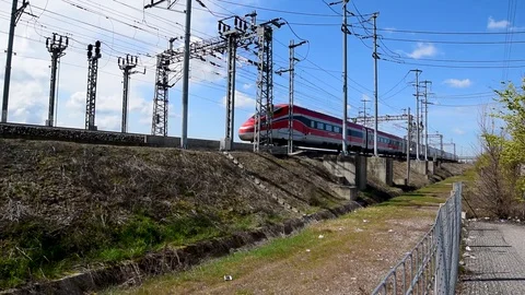Close view of an high speed electric train passing Stock Footage 105356676