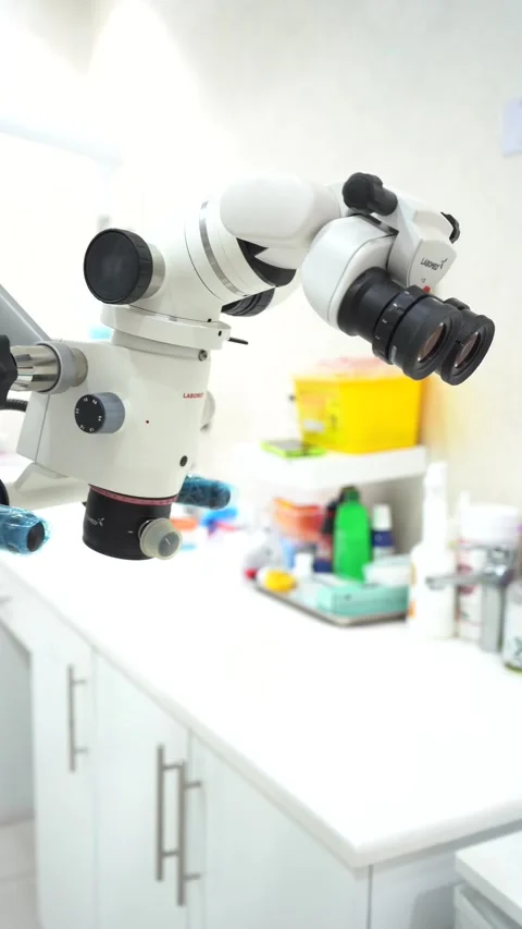 Close-up view of a high-tech surgical microscope on an articulated arm Stock-Footage 335195801