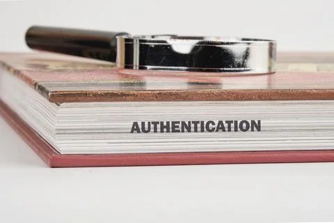 A close-up view highlights the word authentication printed on the edge of a.. 库存照片