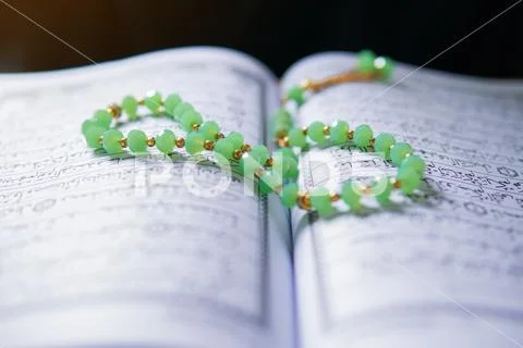 Close view of The Holy Quran and prayer beads Stock Photos