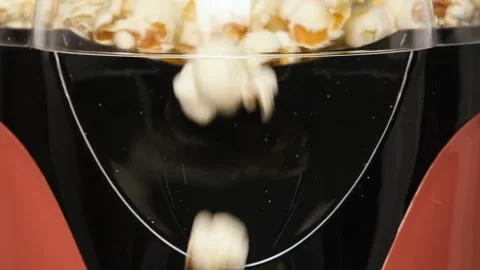 Close up view on home popcorn maker making fresh crispy popcorn. Popcorn popper Stock Footage 278490181
