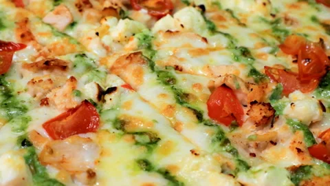 Close-up view on hot pizza with cherry tomato and herbs Stock Footage 140852021