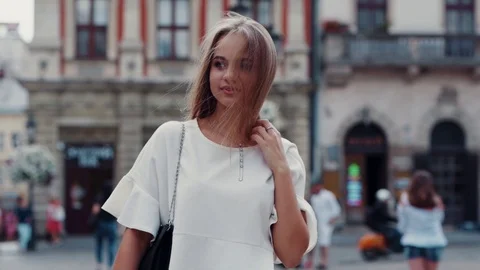 Close up view of hot seductive young woman in stylish white look walking down Stock Footage 112672988