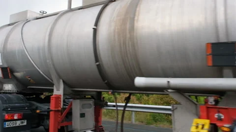 Close up view on huge white petrol truck driving on the highways. The petrol Video stock 219563940