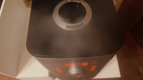 Close-up view of humidifyer producing mist at home. POV using electronic ionizer Stock Footage 260716661