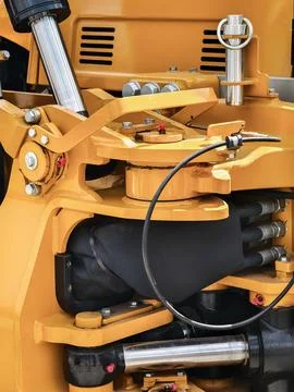 A close view of a hydraulic system in a piece of heavy machinery. The image s Stock Photos