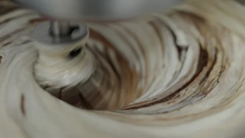 Close-Up View of Ice Cream Being Mixed on a Cold Plate Stock Footage 318544272