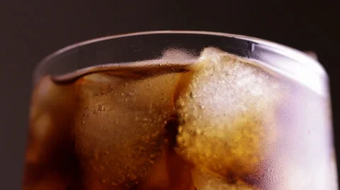 Close up view of the ice cubes in cola background Stock Footage 34311310
