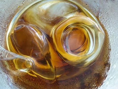 Close up view of the ice cubes in cola Stock Photos