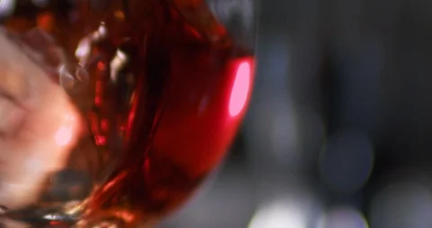 Close up view of ice cubes falling into glass with alcoholic cocktail. Close up Stock Footage 106470586