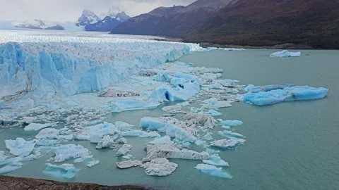Close View Of Icebergs Floating In Teal Water Below Glacier, Argentina 8K Video stock 306470627