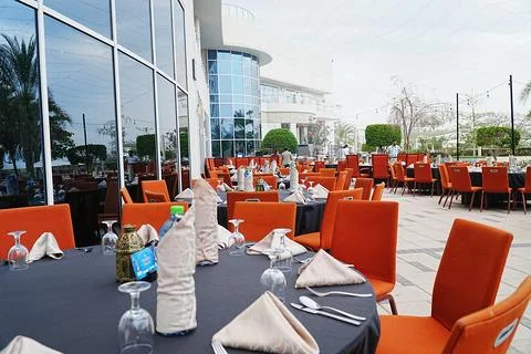 Close view of iftaar setting with tables set in the row, showing round table Stock Photos