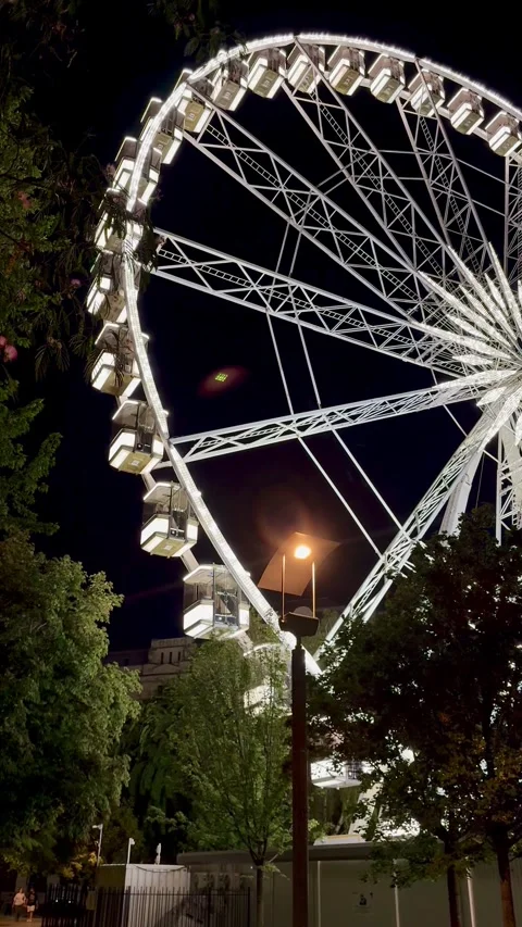Close-Up View of an Illuminated Ferris Wheel at Night in Budapest Stock Footage 344638759
