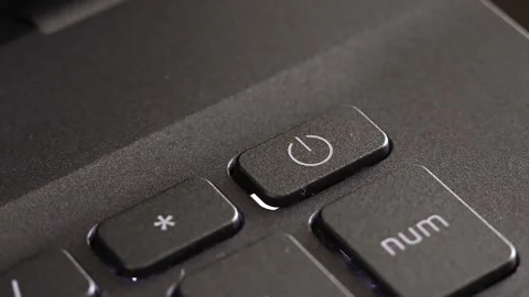 Close up view of index finger pressing laptop power button, notebook keyboard. Stock Footage 291883436