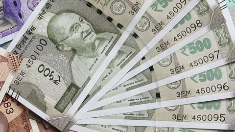 Close-up view of indian rupees banknotes of different values with slow rotation Stock Footage 302582188
