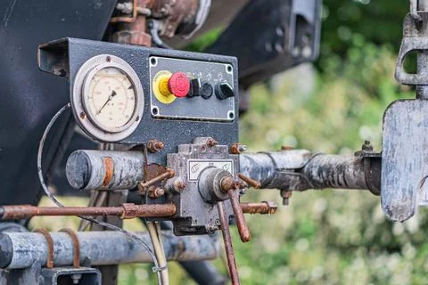 Close-up view of an industrial control panel with a circular gauge, connected Stock Photos