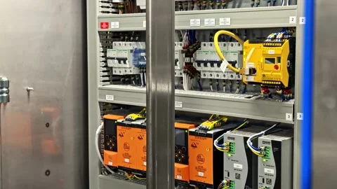 Close up view of industrial electrical control panel with circuit breakers and Stock Footage 332455694
