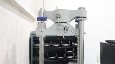 Close-up view of an industrial mechanical testing machine inside a quality Stock Footage 320998743
