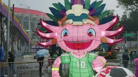 Close view of an inflatable World Cup mascot with a football Stock Footage 345278472