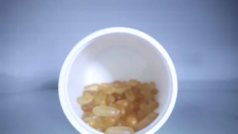 Close-up view inside jar of omega 3 Video stock 156515246