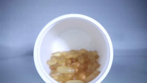 Close-up view inside jar of omega 3 Stock Footage 156704200